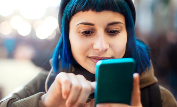 woman with blue hair and blue phone