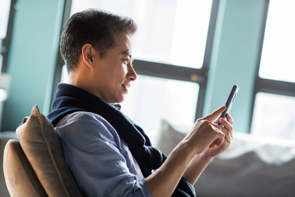 a Consumer on a mobile device representing Digital Transformation Strategy