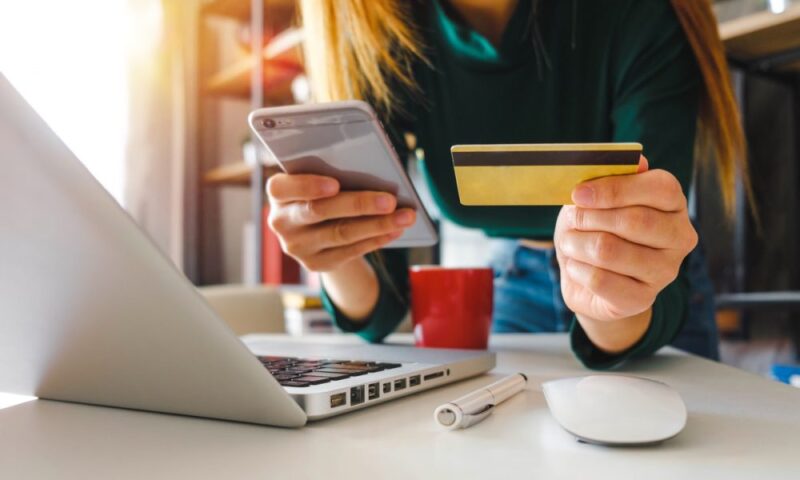 woman using credit card for social commerce
