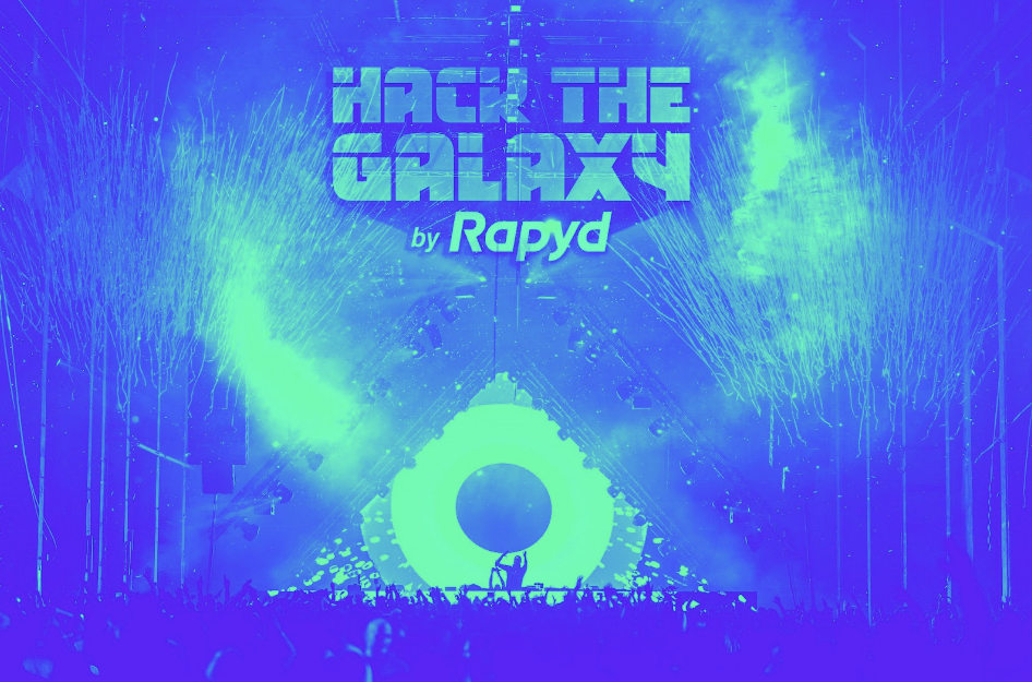 DJ on a stage with the Hack the Galaxy Background