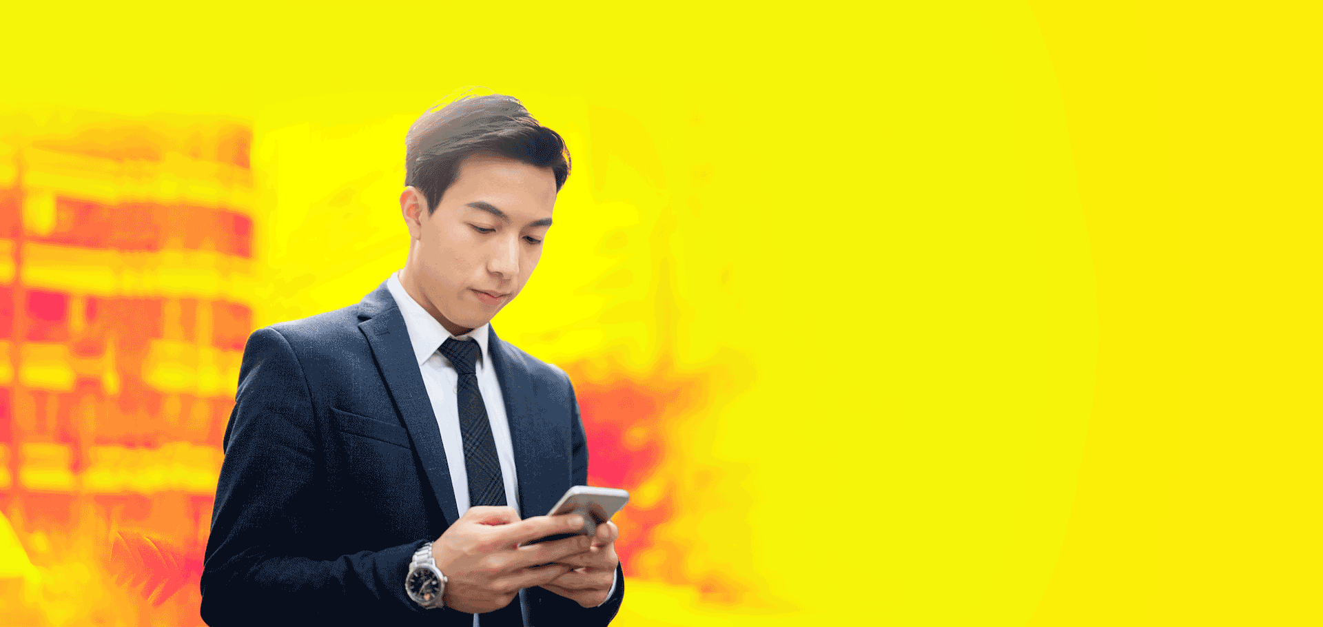 Professional man in suit looking at phone