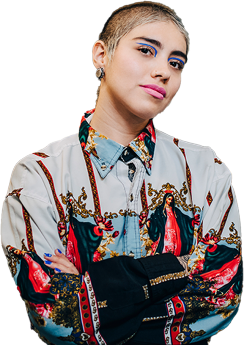 Woman with shaved head and colorful shirt