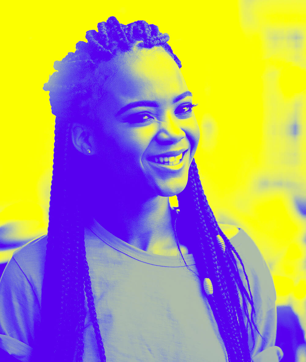 Smiling woman with braids in her hair