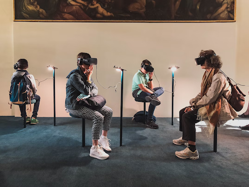 A group of students uses VR googles to learn about art in the metaverse.