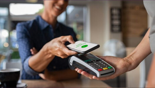 A customer transfers a payment through a payment terminal
