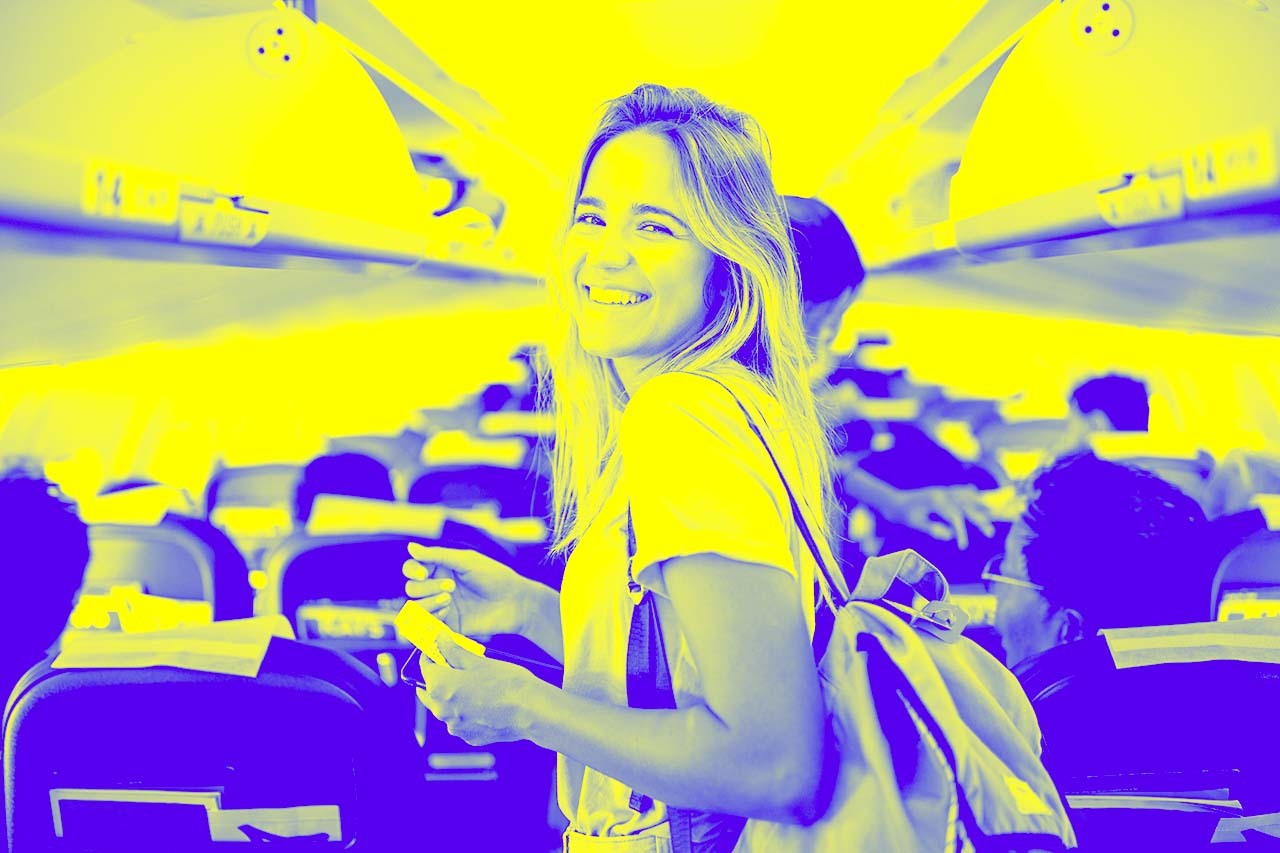 A smiling girl waiting to sit on the plane, representing online travel agencies