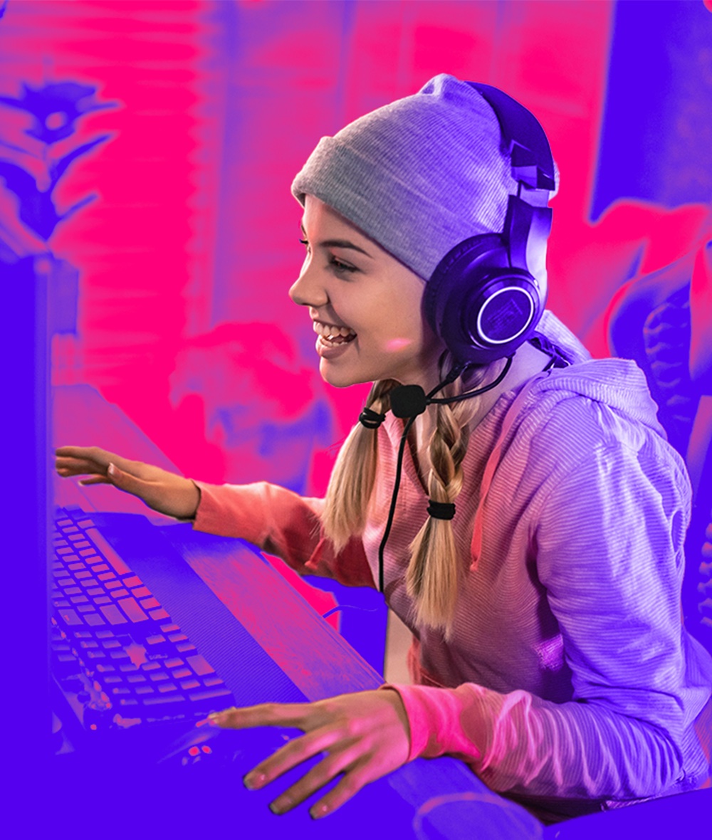 A gamer with headphones is enjoying while playing