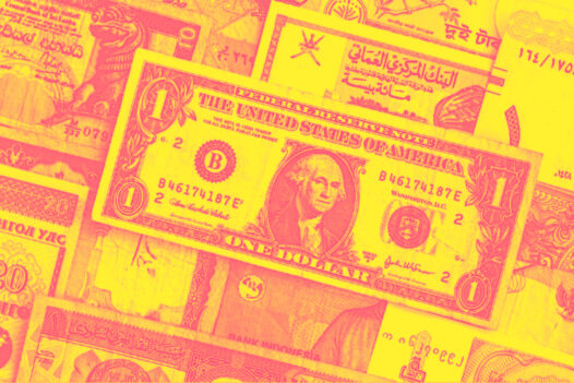 Multiple world currency bills in a pile