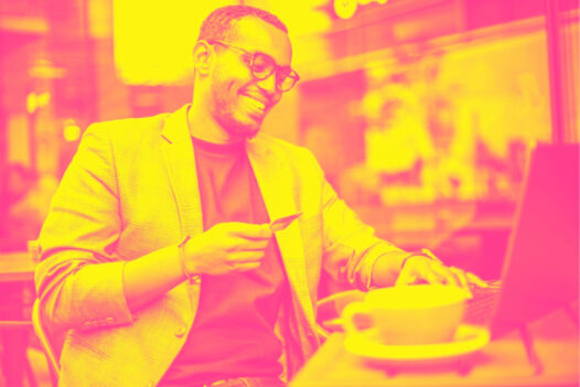 A businessman smiles as he accepts crypto