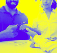 Couple Making A Payment Using A Payment Processor