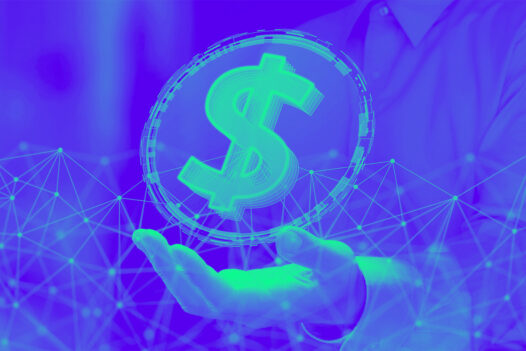 Business person holding $ sign.